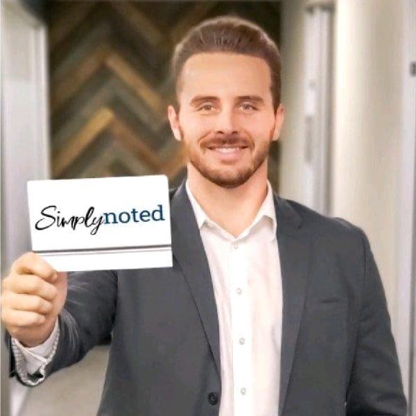 Rick Elmore holding a Simply Noted card